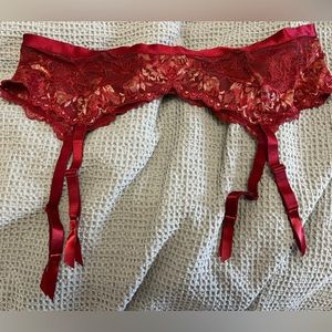 Lace garter belt. Red and cream. Size 1/2. New without tags.